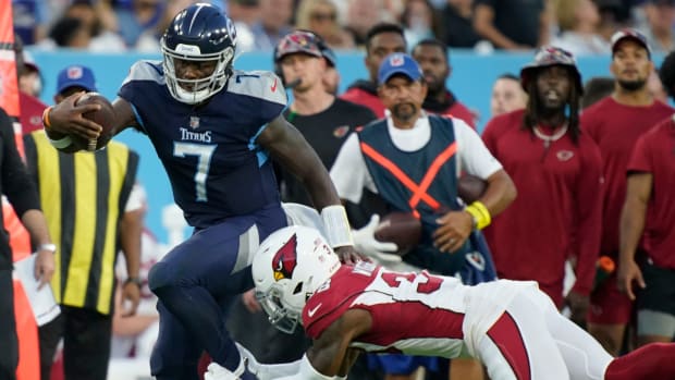 Tennessee Titans quarterback Malik Willis (7) tries to get past Arizona Cardinals safety James Wiggins (38) during the second quarter of an NFL preseason game at Nissan Stadium Saturday, Aug. 27, 2022, in Nashville, Tenn. Nas Titans Cardinals 072  